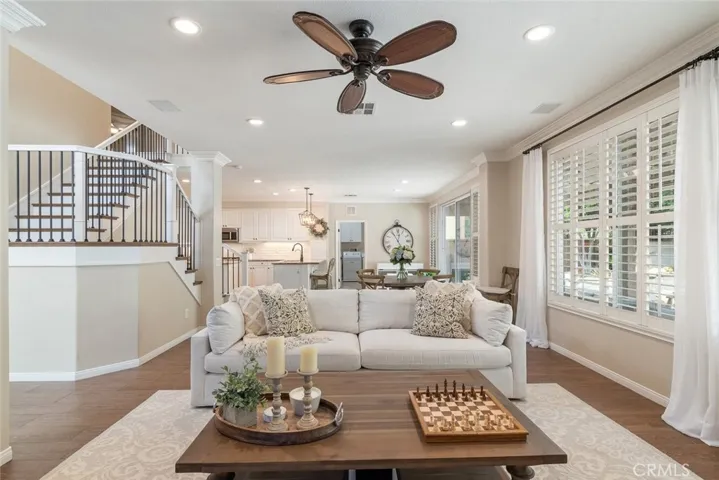 Open concept living room leads effortlessly into the kitchen.  New railings, paint and flooring lead you up to the 2nd level.