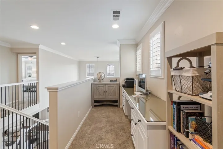 Up the stirs and to the immediate left, is a perfect area for office or kids studies.