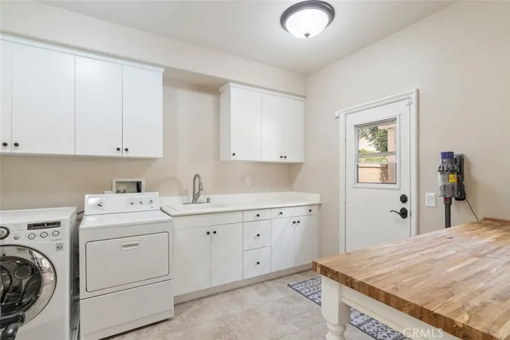 Large laundry area located downstairs and just off the kitchen.
