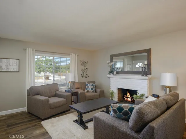 Living room with inviting brick fireplace