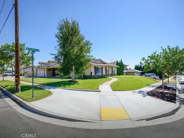 Front and side of home, entrance even offers a handicap ramp at curb