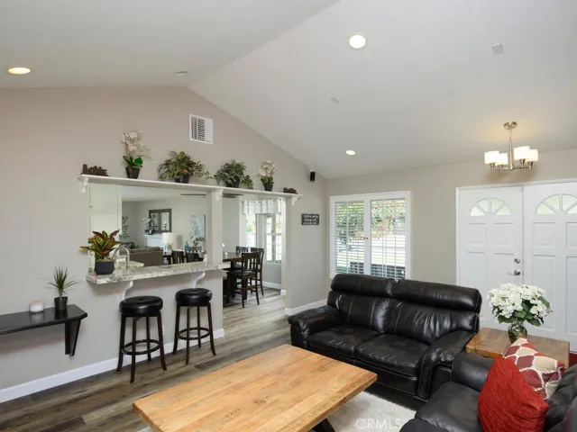 Breakfast bar and view into kitchen/dining area