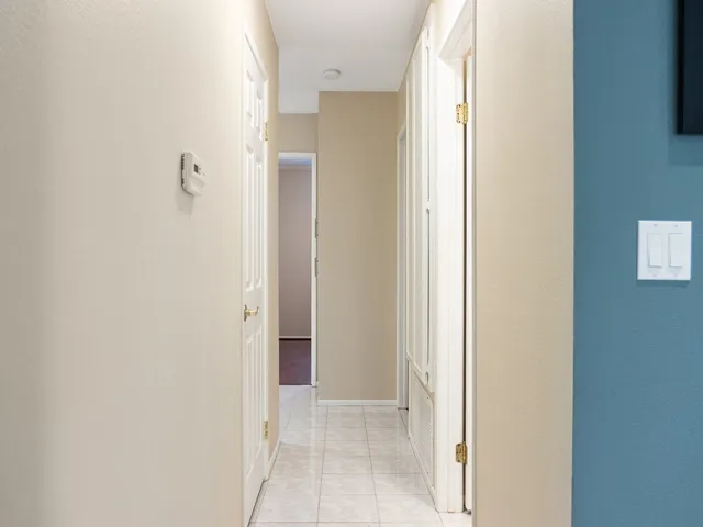 large lighted hallway with plenty of storage.