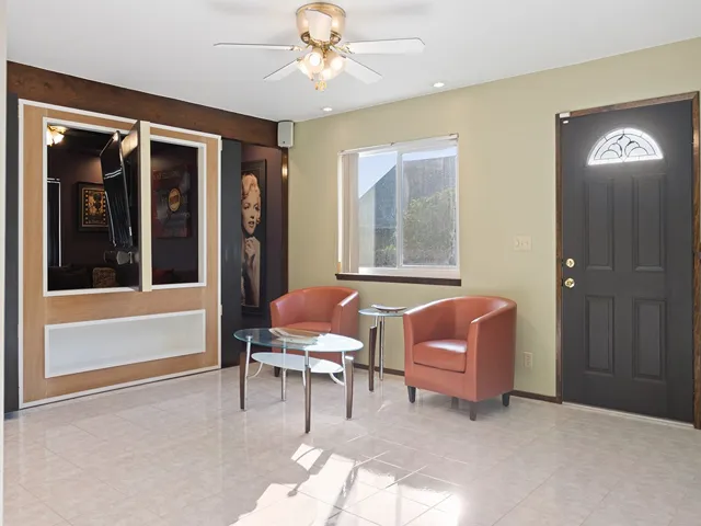 The Lounge, with door to RV parking, great to convert to stucio or office, or master bedroom.