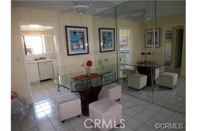 Walls of glass in dining room add to the spacious feeling of this fine unit.