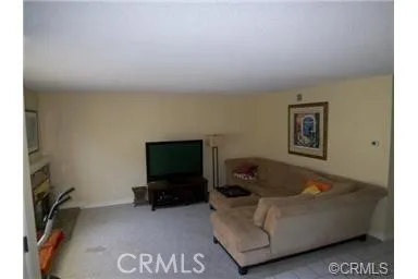 Living room with fireplace for family gatherings or entertaining.