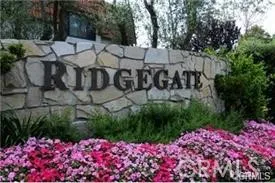 This gated complex offers tennis, sports court and pools