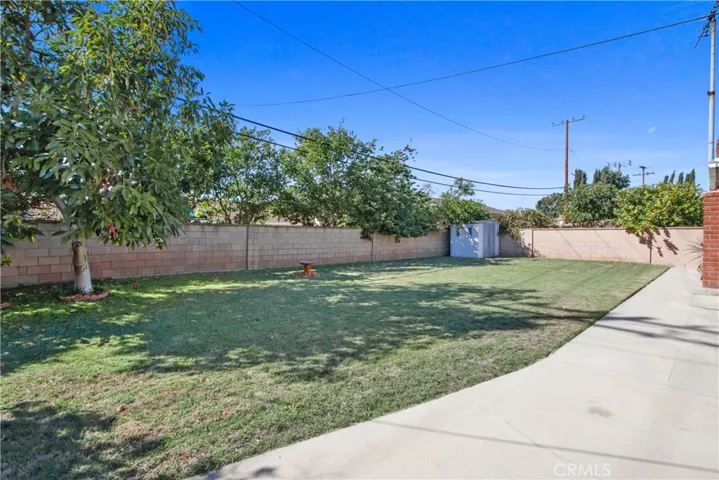 Back yard entirely fenced with block wall!