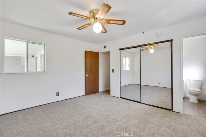 Mirrored closet doors in Primary Bedroom