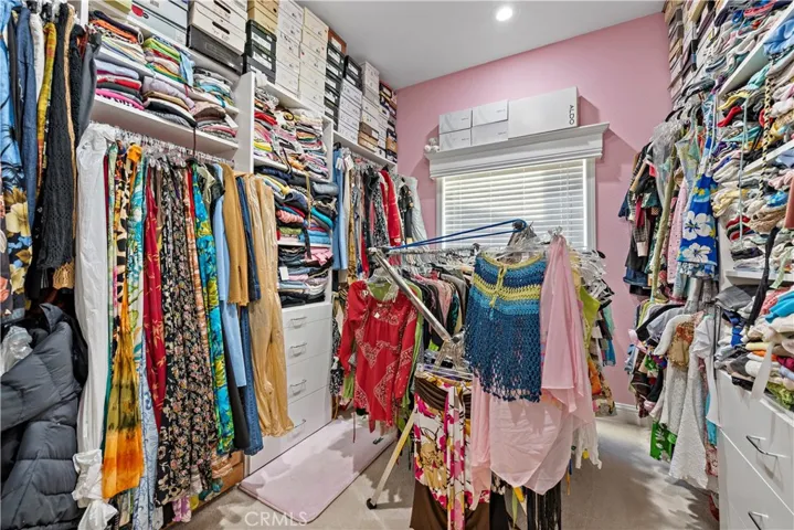 Walk-in closet in master bedroom.