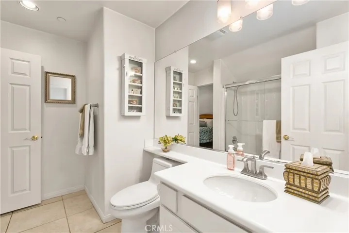 Downstairs Full Bath Is Open To Hallway & Secondary Bedroom