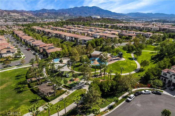 16 Fuchsia is located just steps away from the luscious winding community green belt featuring award-winning amenities of Baker Ranch. Pictured here are the shaded playground structure, bbq, shaded picnic areas.