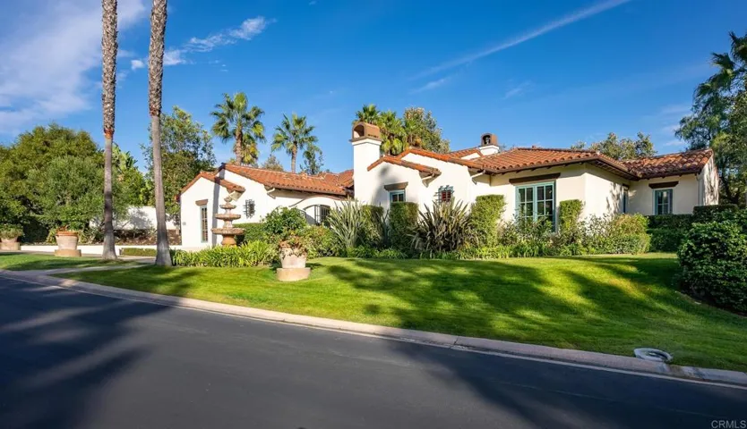 Highly sought after corner lot overlooking two community lakes