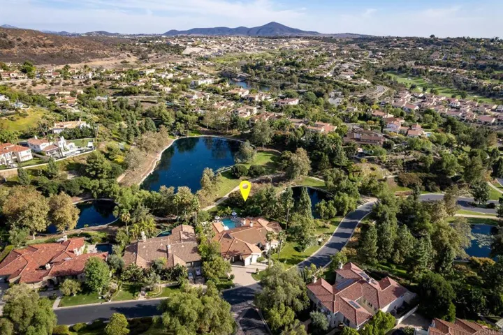 Huge corner lot privately set amidst two of the Crosby's main Lakes. Sprawling front lawn, courtyard