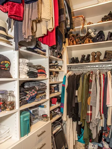 PULL-DOWN CLOTHING RACKS IN MASTER CLOSET