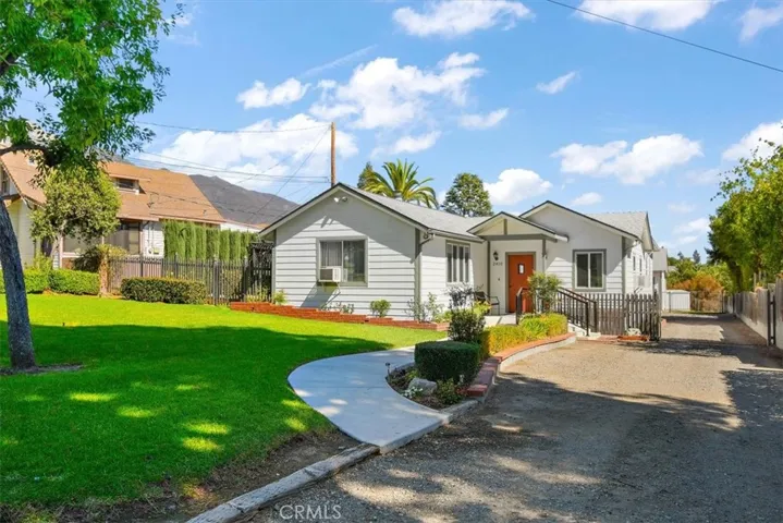 Long private drive to back garage, motorized gate