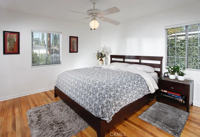  2 additional bright and airy bedrooms. One with lighted ceiling fan and hardwood floors.  The third bedroom is ideal as a nursery, oversized master suite retreat or private office.