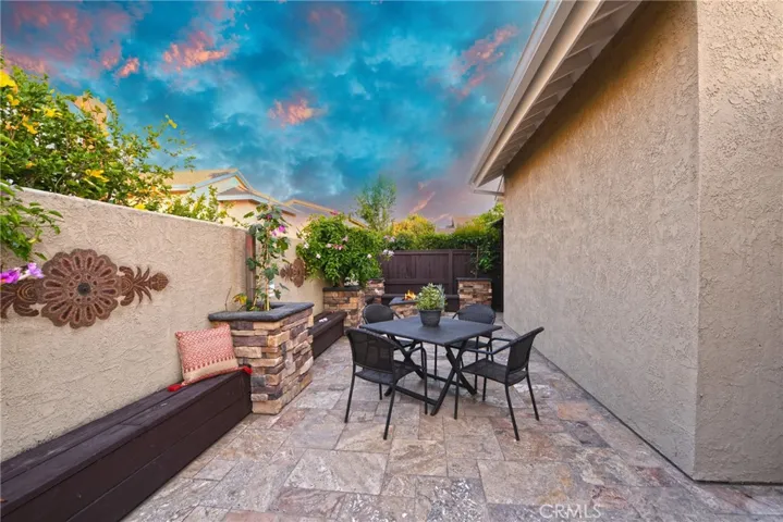 More dining and entertaining space in this fabulous backyard...please note the firepit in the background.