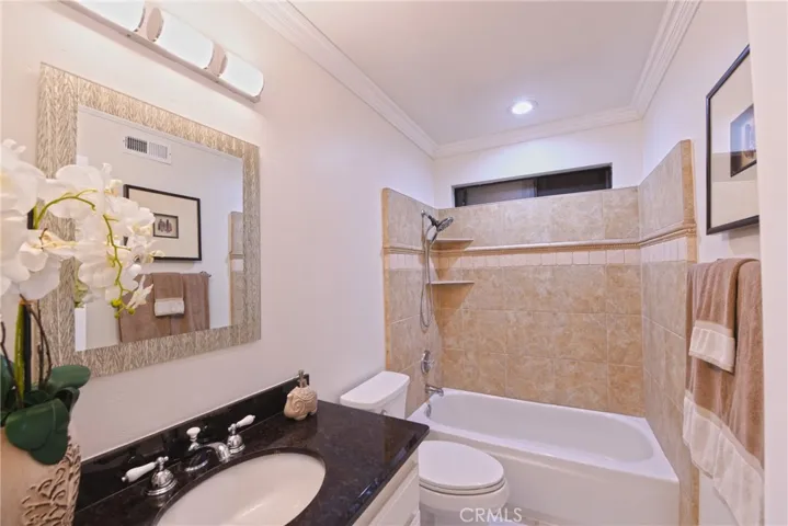 Both secondary bedrooms share a remodeled full hallway bathroom.