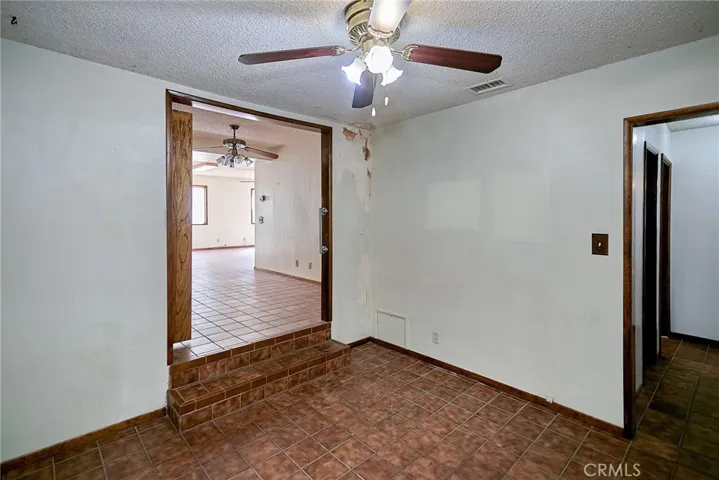 Bonus room/kids play area off the kitchen. The stairs lead to the oversized living room.