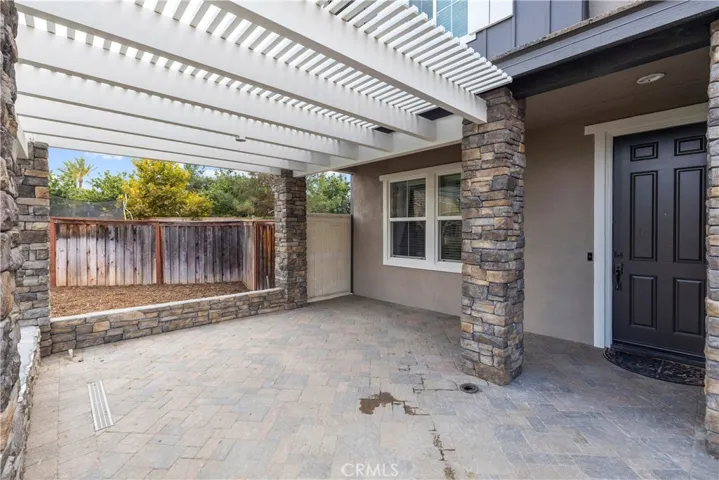 New pergola and stone work.  This a great space for lounge furniture and seasonal decor.
