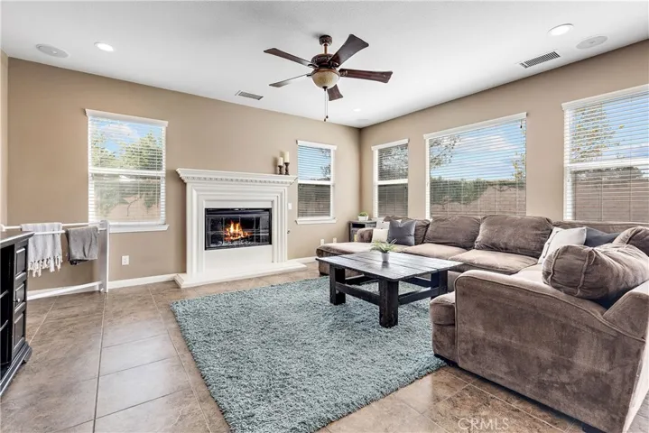 Family room with gas fireplace if off of the kitchen.  There is lots of natural light.