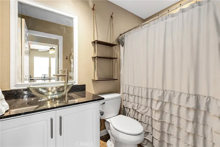 Full bath downstairs, granite counter vanity.