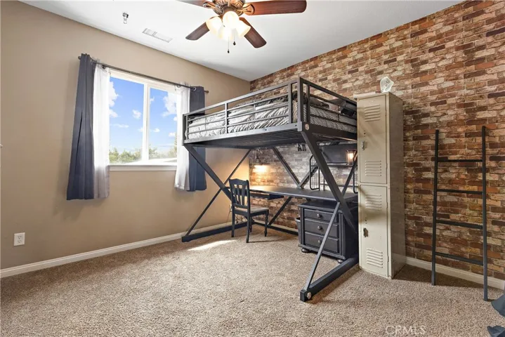 Another bedroom.  Note the brick wall is wall paper, looks great.