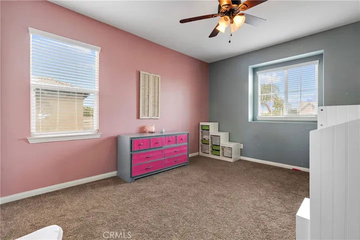 Another bedroom with two windows.