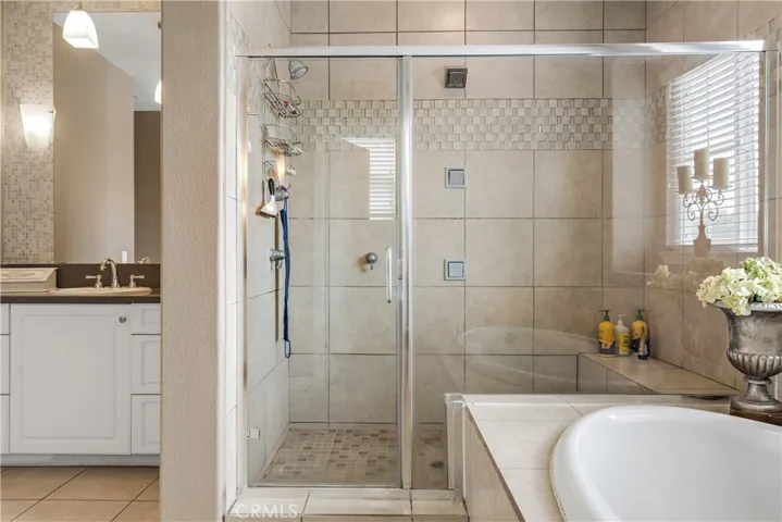 Master bedroom: Walk in shower and sunk in tub.  His and her vanities.