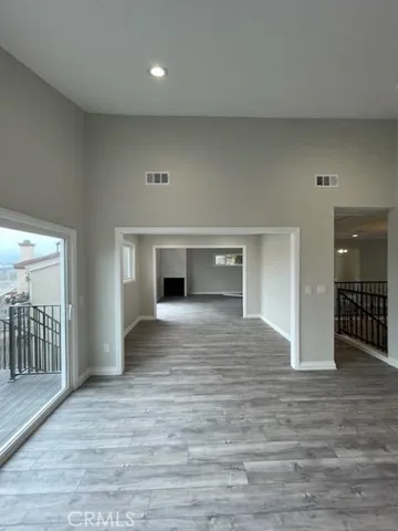 VIEW FROM KITCHEN DINING ROOM TO LIVING/FAMILY ROOM