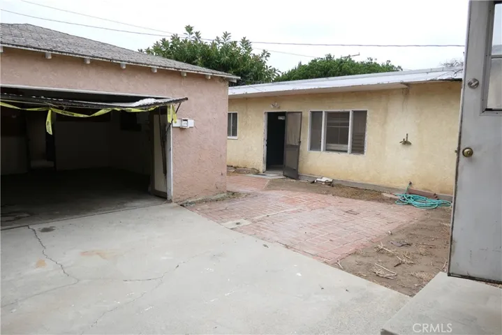 Outside back door, garage left, unit 2 right