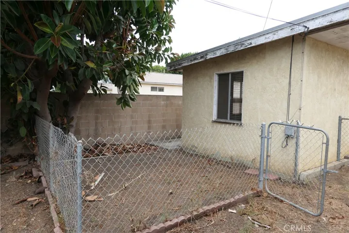 Behind unit 2, fenced area