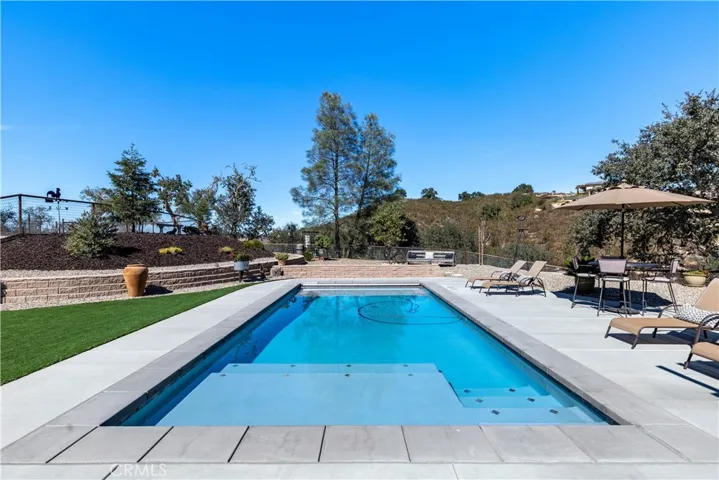 This is the view from inside the home. Look at the gorgeous pool and mountain backdrop.