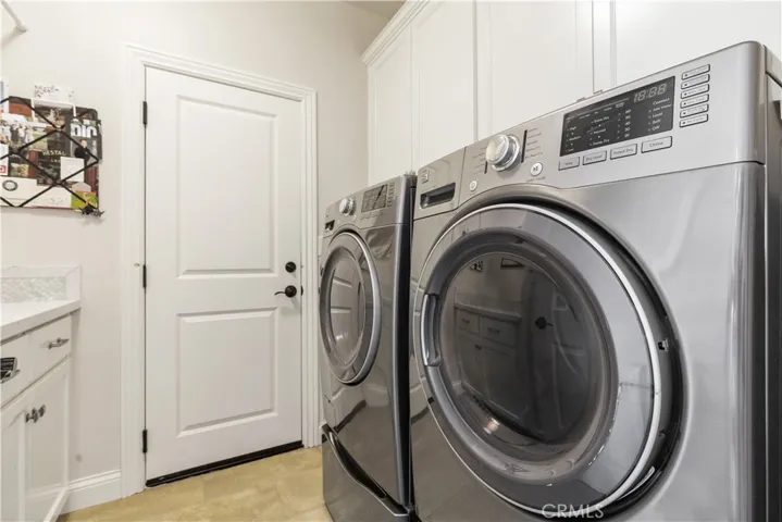 Full size laundry room with Quartz counter