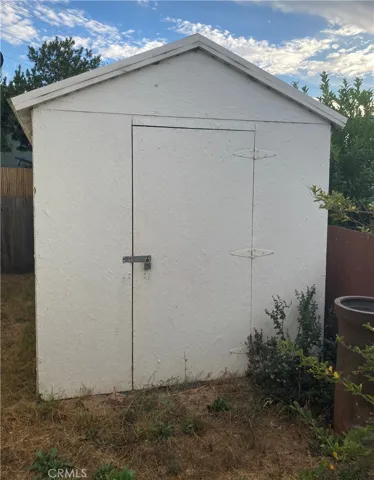 Storage shed at end of driveway