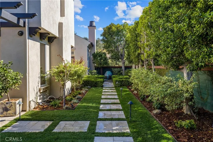 Side yard to the reflection pool and water feature.