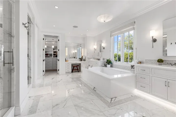 Elegant white Tasso marble throughout.  Large soaking tub.