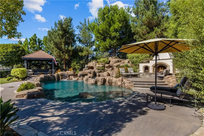 Resort style pool with slide and spa.