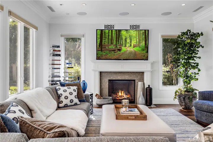 Family room with Marble fireplace.  Four extra windows have been added that gives lots of light.
9 Speaker surround sound system with 2 sub-woofers in the ceiling.