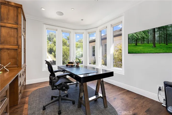 Office off the master bedroom suite with built-ins.
