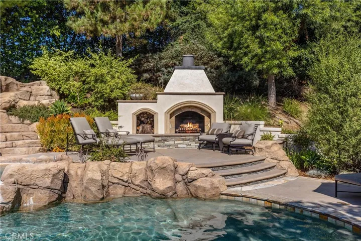 Raised patio with fireplace​​‌​​​​‌​​‌‌​​‌​​​‌‌​​​‌​​‌‌​​‌‌​​‌‌​​​​ area.