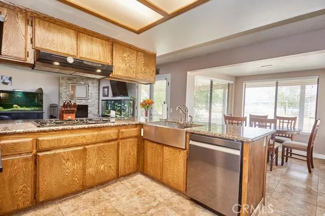 Great layout with dishwasher right next to the stainless steel farmhouse style apron sink.