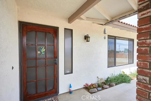 Welcoming front entry with security screen. Enjoy beautiful desert breezes in the evenings.