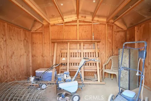 Shed will remail with the property. Large storage shed with insulated roof.