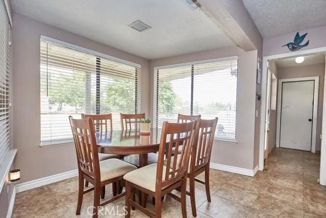 Large kitchen dining area fits a table for six with plenty of walking space.