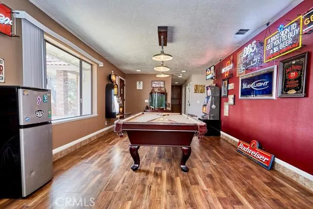 Game room off the entry is wide making it conducive for billiard games.