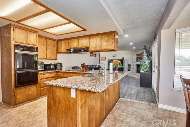 Five burner stove top, wall oven, and Bluetooth enabled dishwasher that is about 6 months old.