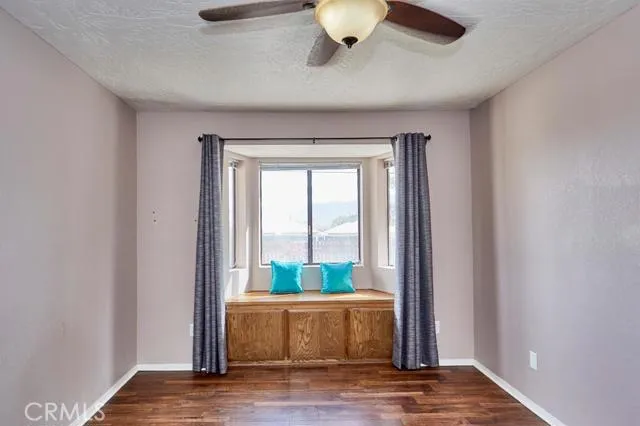 Hall bedroom features a seated bay window.