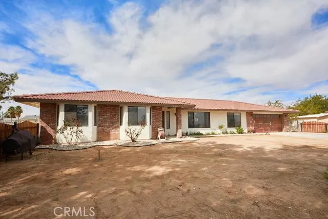 Well shaded lot with mature trees in the front and rear yards. Decorative flowerbeds offer color in Spring.
